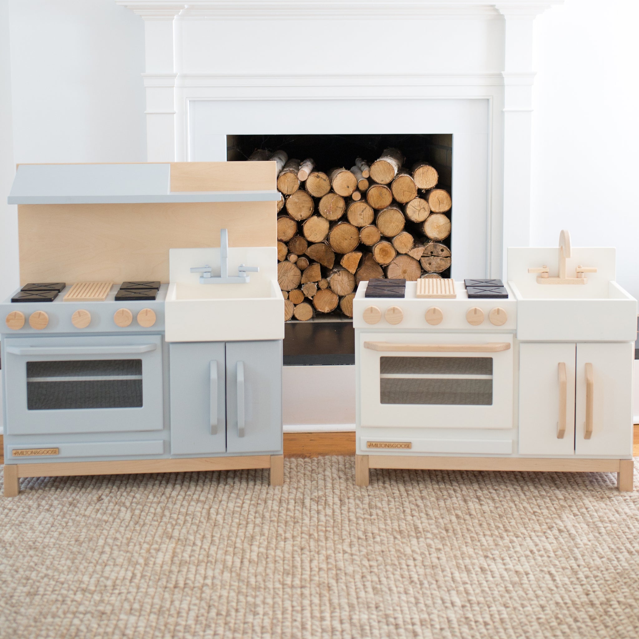 Milton and Goose Essential Play kitchen in white and gray. The gray kitchen includes the additional hood.