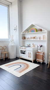 Milton and Goose Essential Play Kitchen and House Shelf in White. Playroom with rainbow run in front of kitchen set. IG profile credit @sajolee