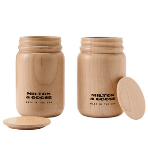 A set of 2 wooden mason jars with flat lids. Jars are laser engraved and finished with a clear finish.