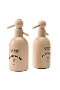 Two wooden seltzer bottle toys standing together.