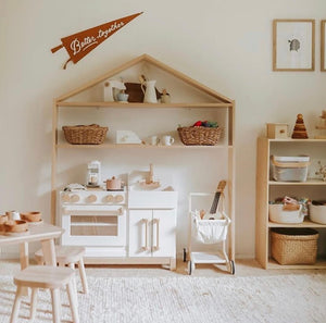 Milton and Goose wooden play kitchen with house shelf over it.