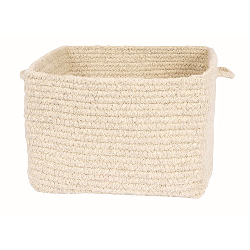 A chunky braided basket made of 100% undyed wool in the color "natural". 