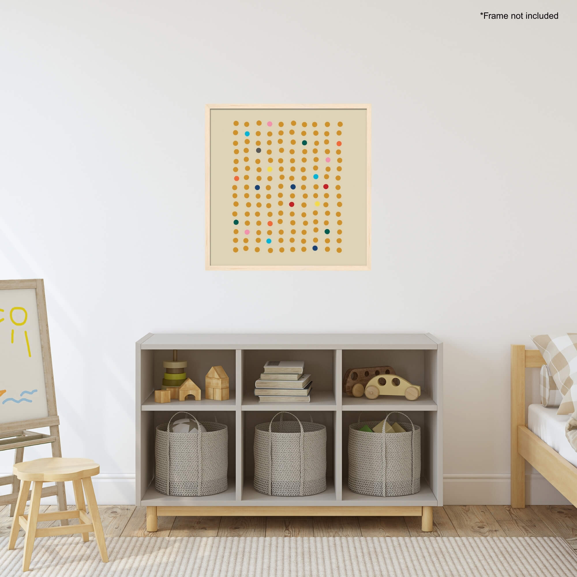 A colorful dot painting on the wall in a maple frame in a colorful child's room.