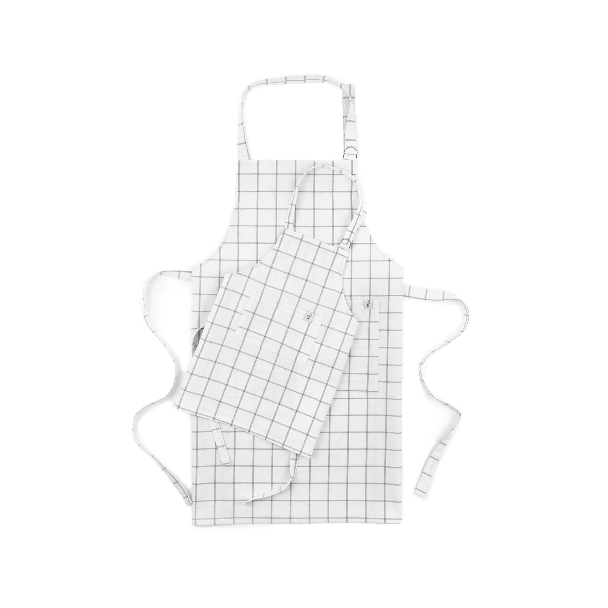 One adult-sized and one child-sized apron with a grid pattern, displayed on a white background.
