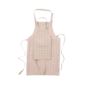 Matching adult and child beige apron with a grid pattern on a white background
