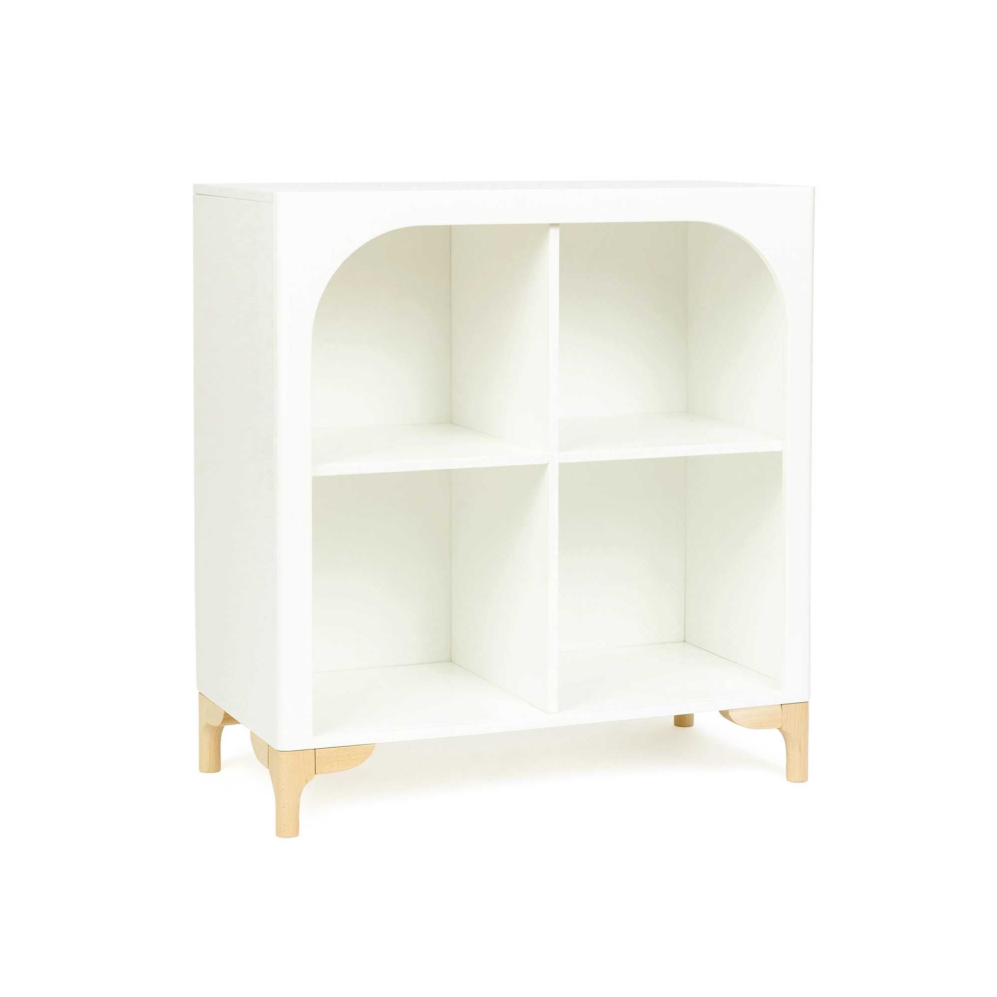 The wooden Archie Bookshelf by Milton & Goose sits at an angle so you can see the right side of the bookshelf. 