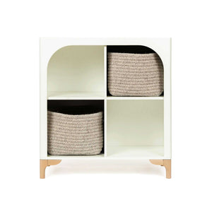 The wooden Archie Bookshelf by Milton & Goose featuring two Natural Wool Shelf Baskets.