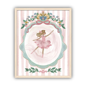 Framed artwork of a ballerina with blond hair in a pink dress with floral decorations on a striped background in a maple frame.