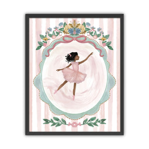 Framed artwork of a ballerina with black hair in a pink dress with floral decorations on a striped background in a black frame.