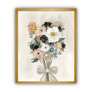 Framed floral artwork with a bouquet of flowers and a bow on a beige background in a gold frame.