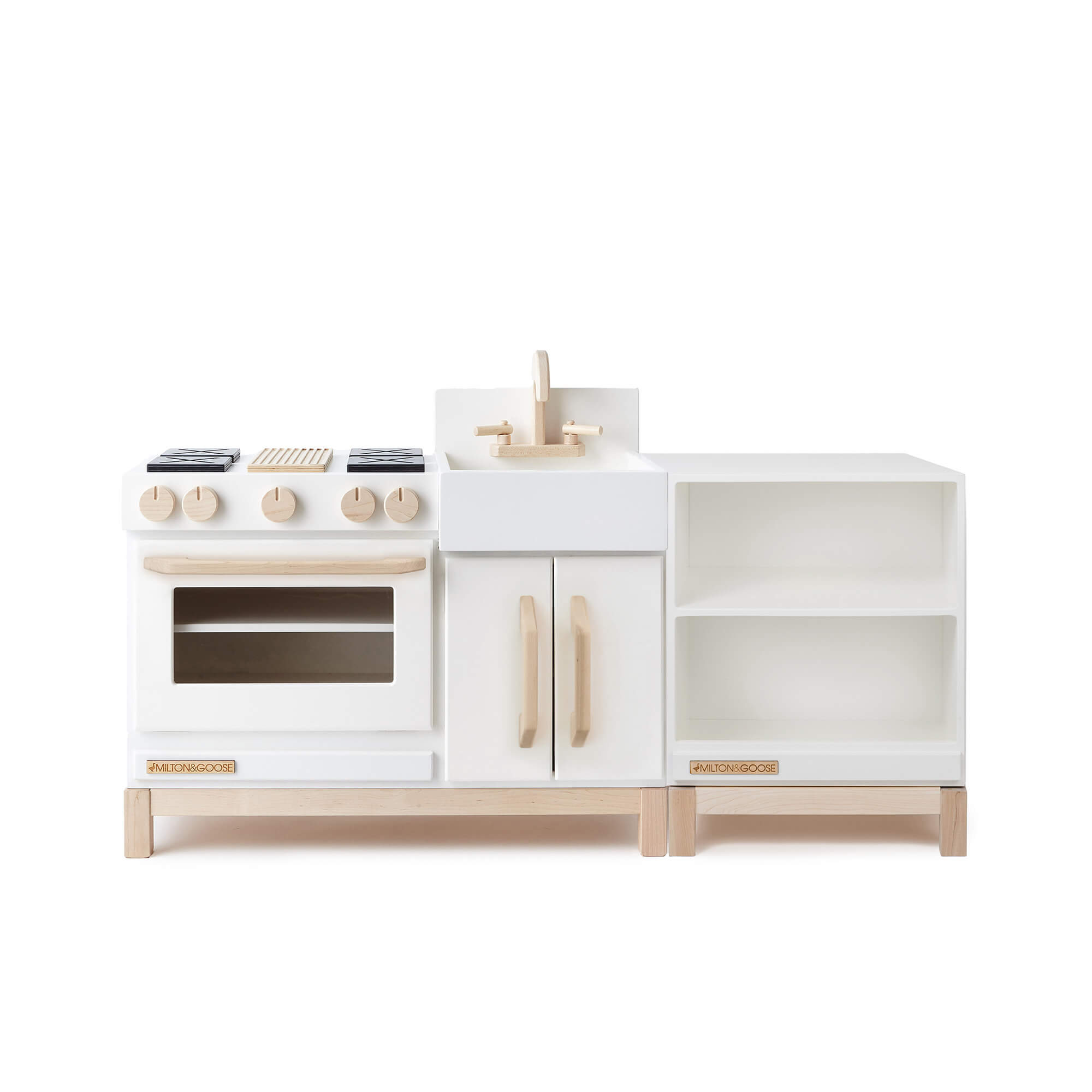 The wooden Essential Play Kitchen Countertop in White is shown next to the Essential Play Kitchen in White. Both are facing forward. 