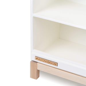Bottom corner of the wooden play kitchen countertop add-on for the Essential play kitchen by Milton & Goose in white on a white background