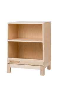 The wooden Essential Play Kitchen Countertop in White is shown facing at an angle, towards the left. 