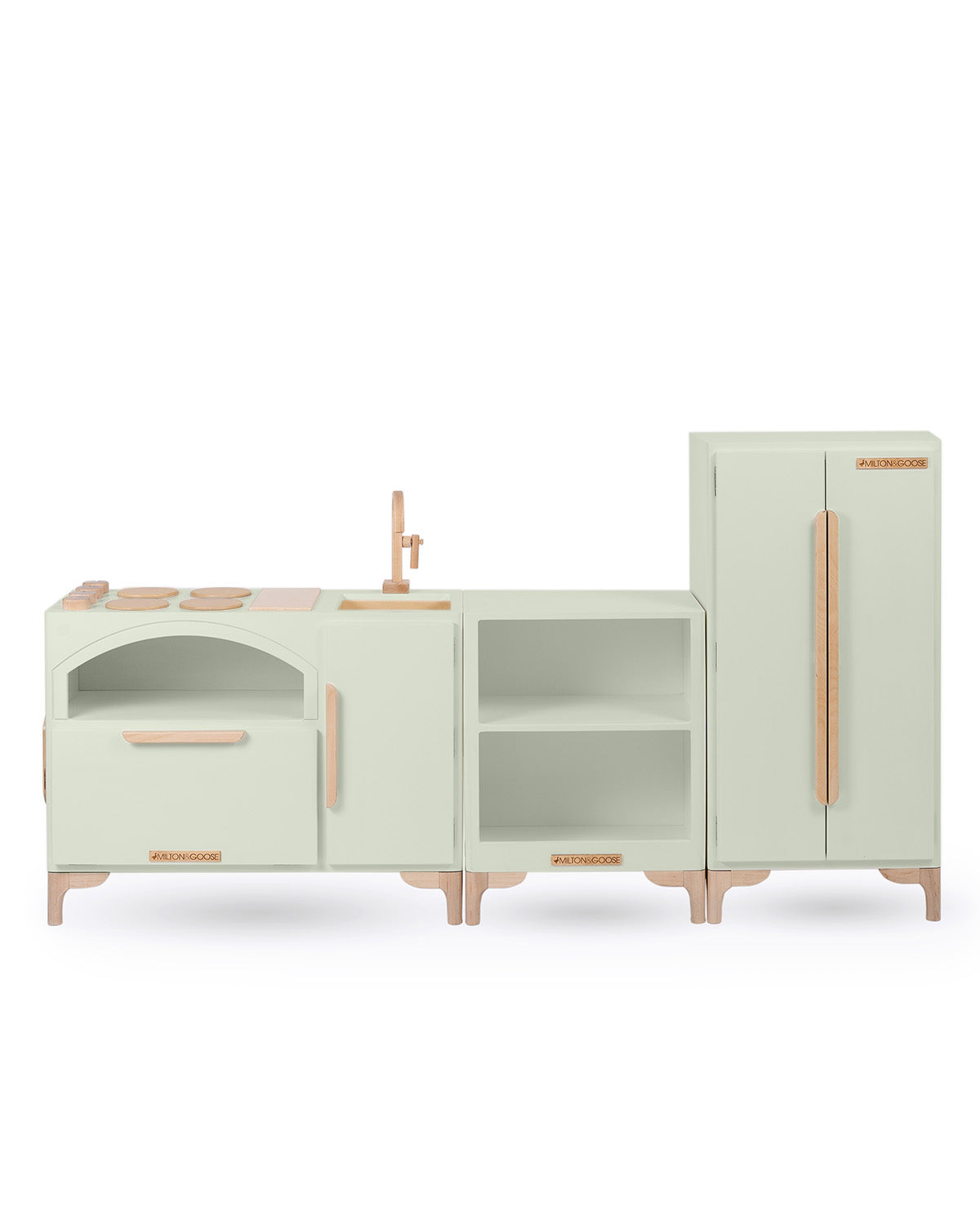 Milton & Goose Luca Play Kitchen collection in light sage. Collection includes the Play Kitchen with pizza paddle, Countertop, and play refrigerator.