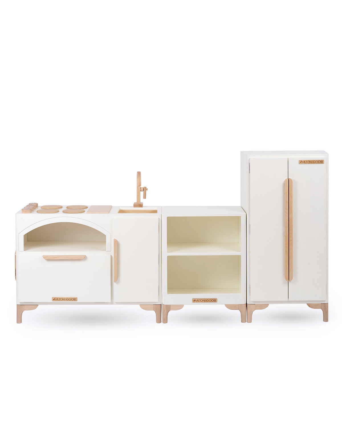 Milton & Goose Luca Play Kitchen collection in white. Collection includes the Play Kitchen with pizza paddle, Countertop, and play refrigerator.
