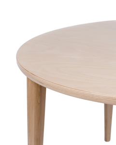 Close up of the Milton & Goose Round Crescent table in natural wood.