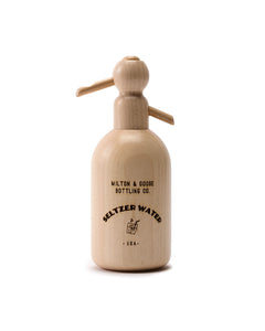 Wooden seltzer bottle toy. Bottle says "Milton & Goose Bottling Co. Seltzer Water USA"