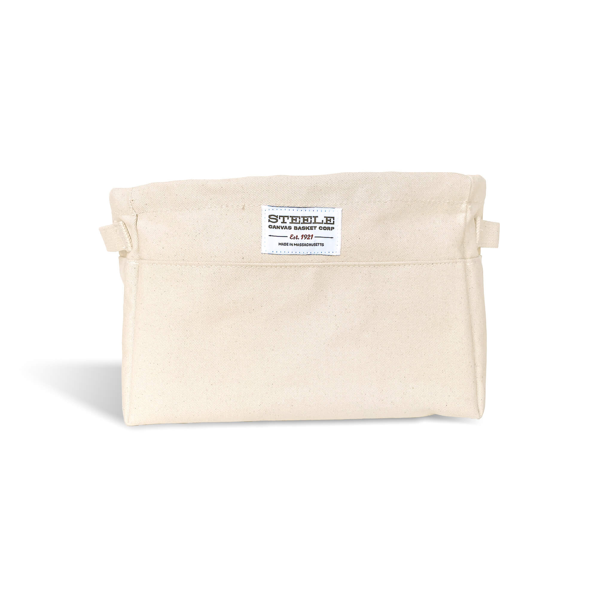 Beige canvas bin with two handles on a white background