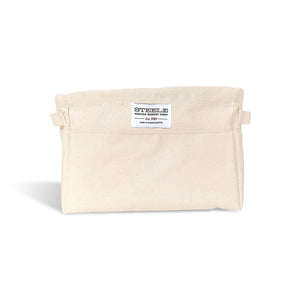 Beige canvas bin with two handles on a white background