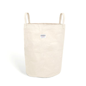 Tall canvas storage bin with handles on a white background