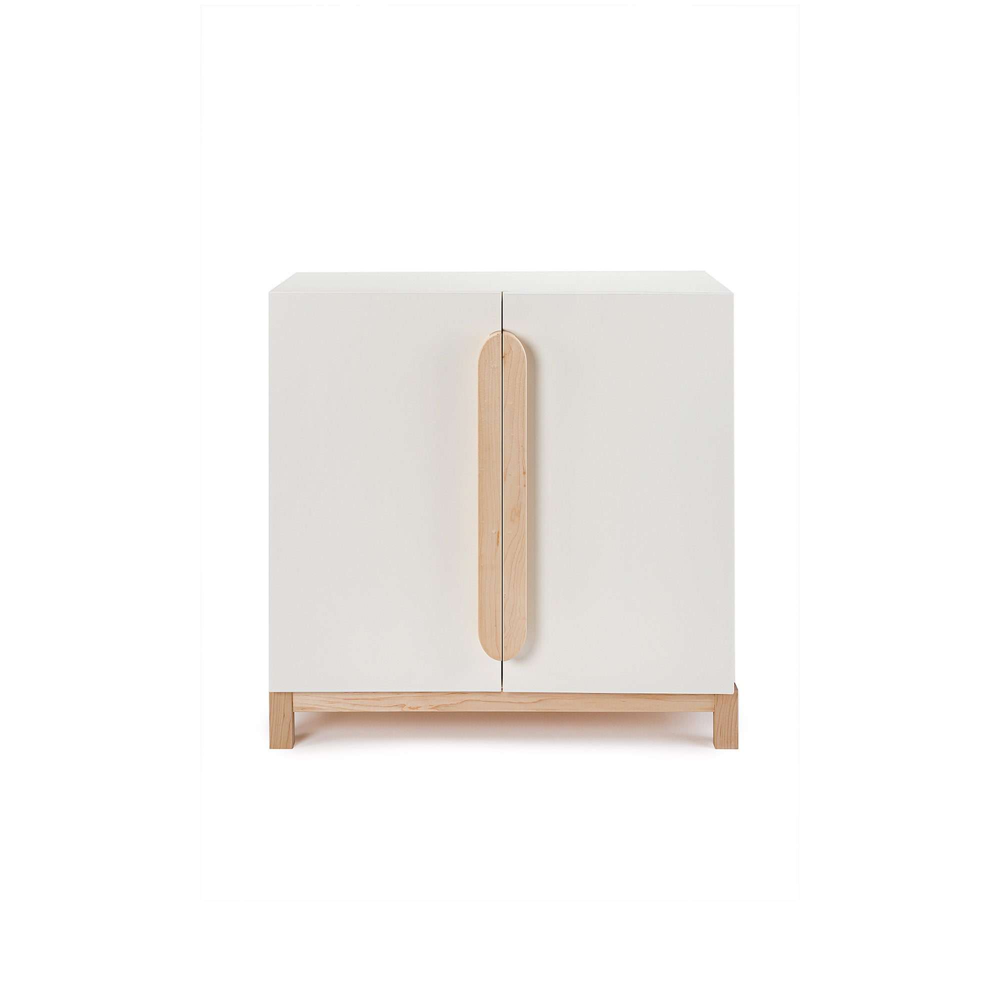 Playroom storage cabinet in white. Built with solid baltic birch plywood and non-toxic finishes. Stands at 30 inches and has 2 soft close doors.