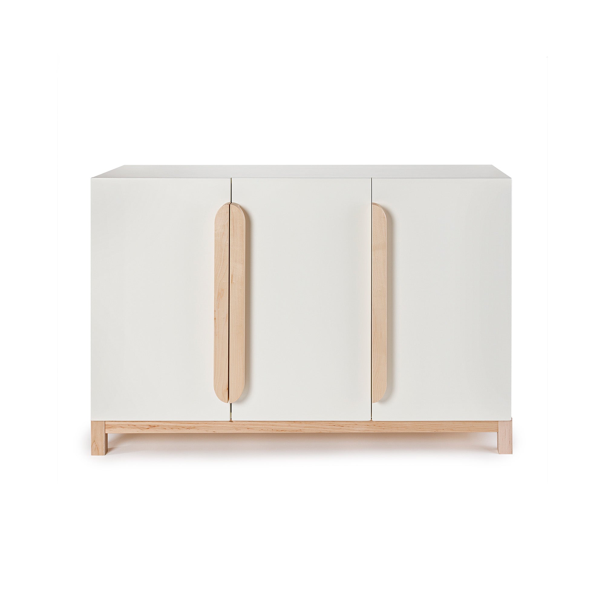 Playroom storage console in white. Built with solid wood and non-toxic finishes. Features 3 soft close doors and adjustable shelf.