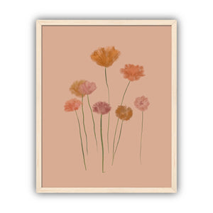 Framed artwork of stylized flowers in gold and pink tones on a beige background, framed in maple.