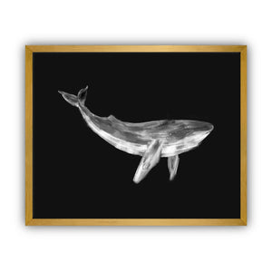 Framed artwork of a whale on a black background in a gold frame.