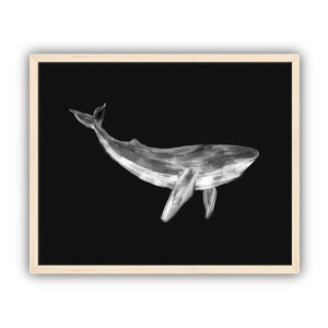Framed artwork of a whale on a black background in a maple frame.