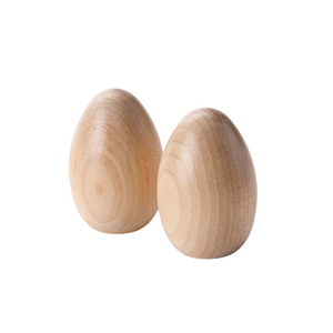 Two wooden pretend eggs sit in front of a white background. The wood grain shows beautifully through a clear finish.