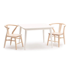 Milton & Goose's white crescent table paired with the natural maple crescent children's chairs.