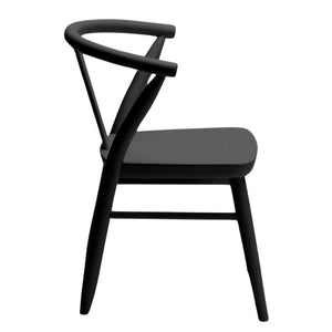 A single Milton & Goose kid's wood Crescent Chair in black is shown from the side, with the seat facing the right. 