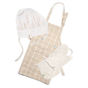 The Milton & Goose little chef play bundle is shown in tan. It includes a cream chef hat, tan child's apron, and tan play oven mitt and hot pad.