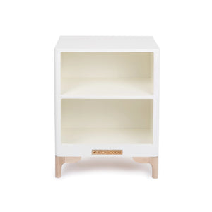 The Luca Countertop in White is a beautifully crafted, heirloom-quality piece made from durable wood. Designed to last, this countertop features a horizontal shelf inside, creating two spacious cubby storage areas. This is shown facing forward. 