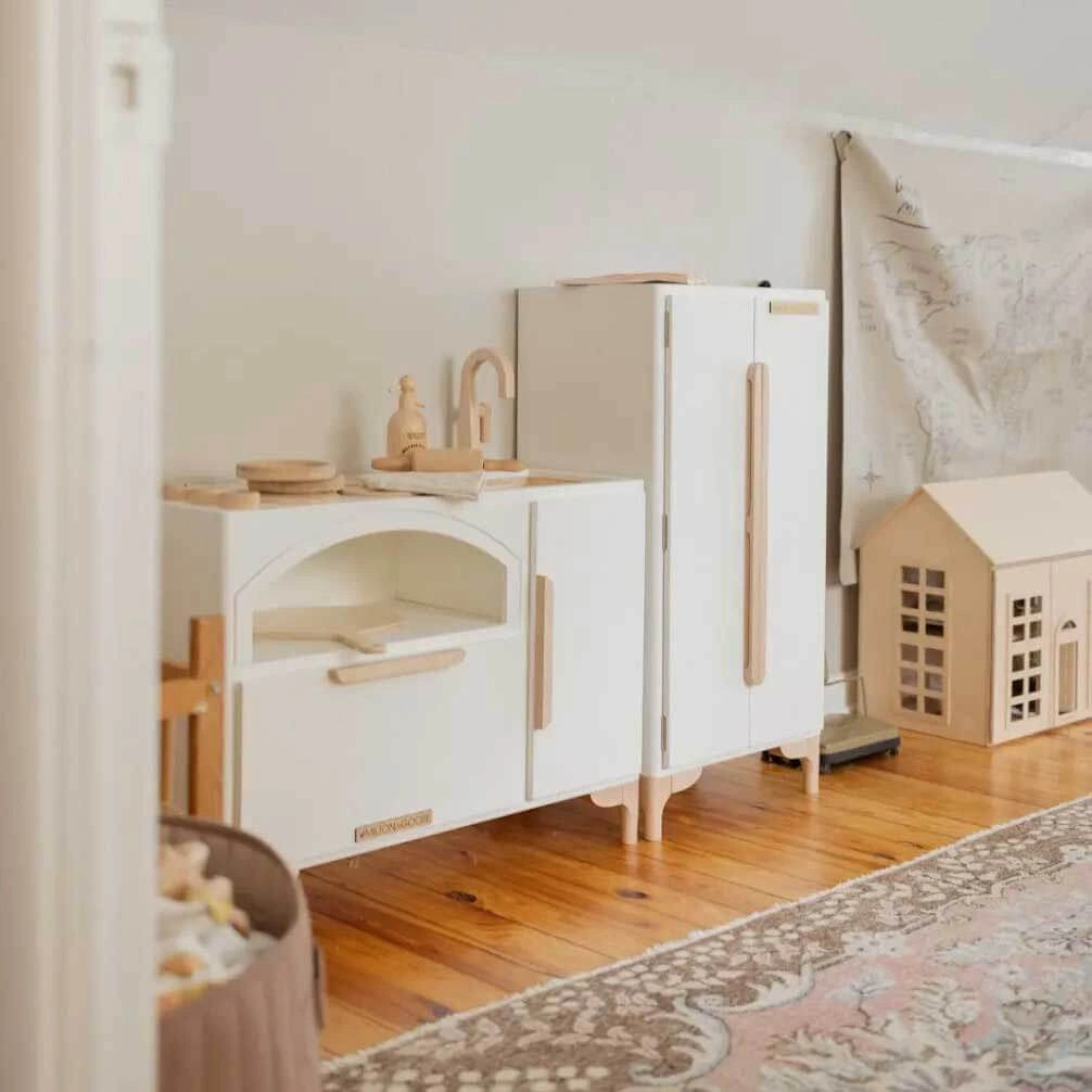 Luca Play Kitchen 2-Piece Set in White in a playroom – Minimalist Wooden Kitchen and Refrigerator Set by Milton & Goose