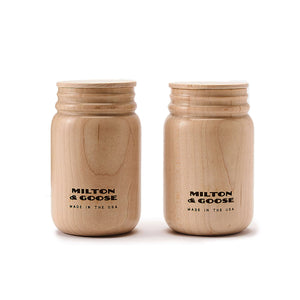 A set of 2 wooden mason jars with flat lids. Jars are laser engraved and finished with a clear finish.