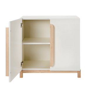 The Terry Storage Cabinet in white is shown with a door open. The shelf is shown inside. 