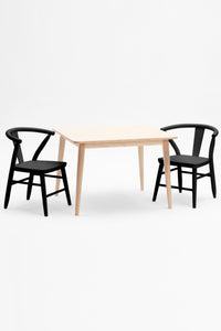 Milton and Goose Crescent Children's table with natural wood finish and chairs painted in black.  Made with sustainable materials and non-toxic finishes.