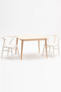 Milton and Goose Crescent Children's table in natural wood finish and chairs painted in white.  Made with sustainable materials and non-toxic finishes.