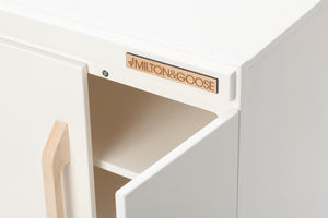 Closeup of Milton & Goose's wooden play refrigerator in white.