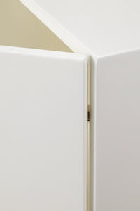 View of the hinges from the outside of the Milton & Goose cabinet. Hinges are barely visible in the picture to display that they are hidden from view on the outside.