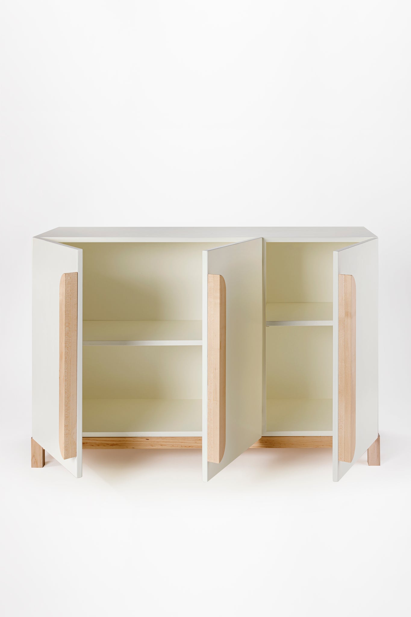 Doors wide open on the Milton & Goose Credenza in White. Inside features a shelf for plenty of storage.